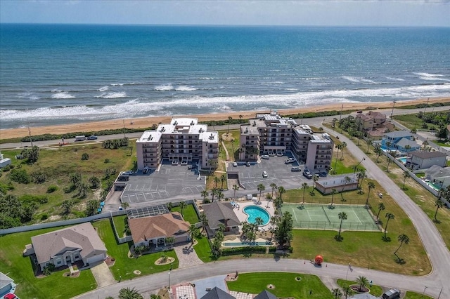 birds eye view of property featuring a view of the beach and a water view