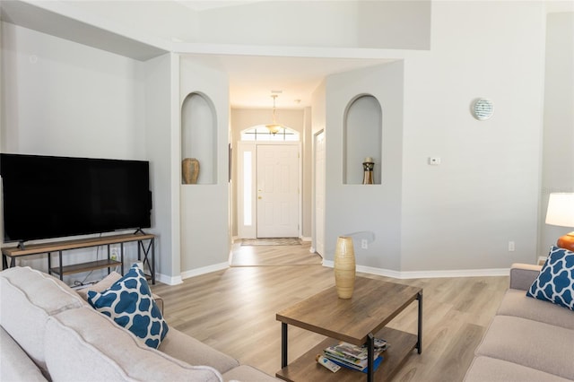 125 Raintree Cir, Palm Coast, FL 32164 - living room featuring baseboards and light wood-style floors