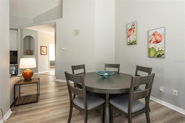 125 Raintree Cir, Palm Coast, FL 32164 - dining room with baseboards and light wood-type flooring