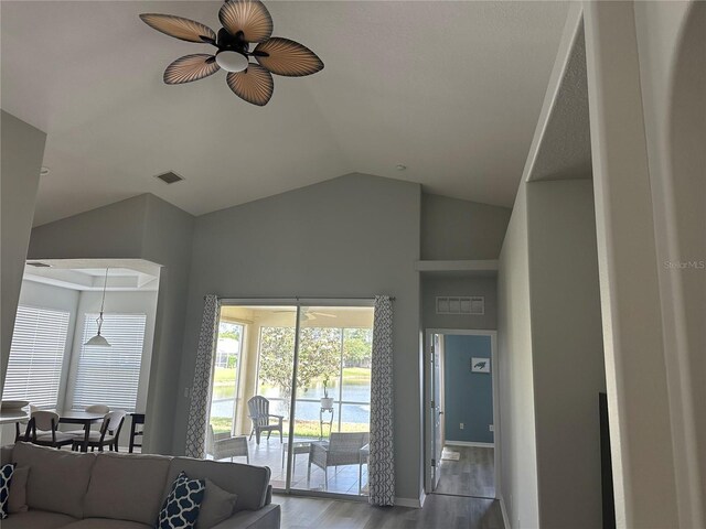 125 Raintree Cir, Palm Coast, FL 32164 - living area with ceiling fan, lofted ceiling, visible vents, and wood finished floors