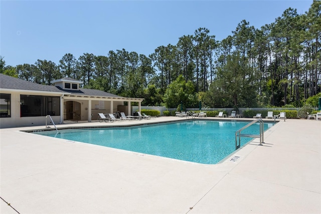 125 Raintree Cir, Palm Coast, FL 32164 - community pool featuring a patio and fence