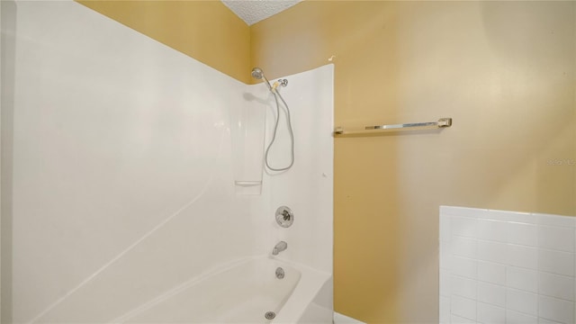 689 16th St, Saint Augustine, FL 32080 - full bathroom with tub / shower combination and a textured ceiling