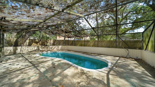 689 16th St, Saint Augustine, FL 32080 - view of swimming pool featuring a patio area, a fenced backyard, and glass enclosure