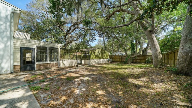 689 16th St, Saint Augustine, FL 32080 - fenced backyard featuring a sunroom