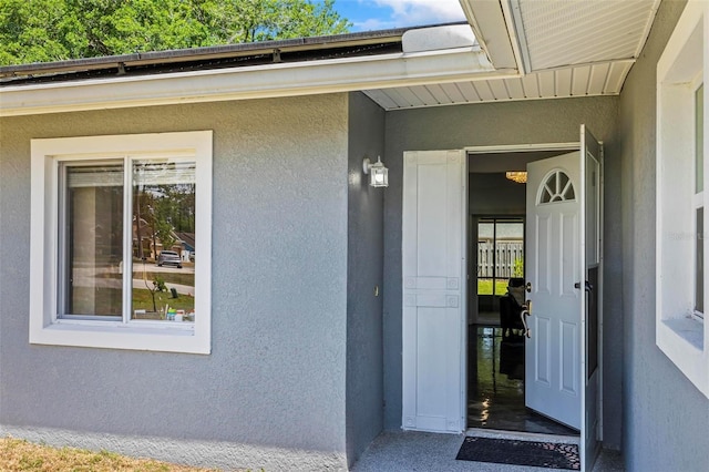 13 Belleaire Dr, Palm Coast, FL 32137 - doorway to property with stucco siding
