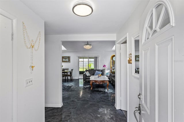 13 Belleaire Dr, Palm Coast, FL 32137 - corridor featuring baseboards and concrete floors