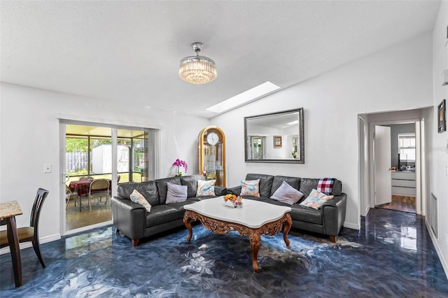 13 Belleaire Dr, Palm Coast, FL 32137 - living area with baseboards, lofted ceiling with skylight, and visible vents