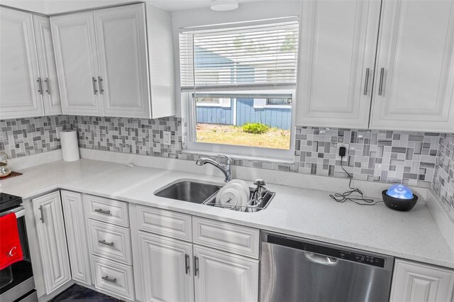 13 Belleaire Dr, Palm Coast, FL 32137 - kitchen featuring white cabinets, a sink, and dishwasher