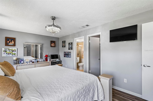 13 Belleaire Dr, Palm Coast, FL 32137 - bedroom featuring a textured ceiling, visible vents, baseboards, dark wood-style floors, and ensuite bathroom
