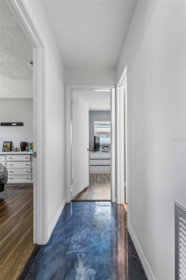 13 Belleaire Dr, Palm Coast, FL 32137 - corridor with a textured ceiling and baseboards