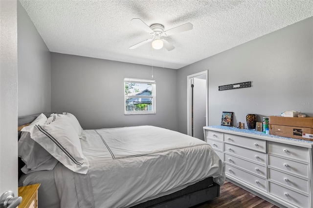13 Belleaire Dr, Palm Coast, FL 32137 - bedroom featuring a ceiling fan, dark wood-style flooring, and a textured ceiling