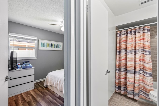 13 Belleaire Dr, Palm Coast, FL 32137 - full bathroom with toilet, visible vents, curtained shower, and wood finished floors