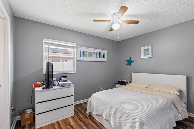 13 Belleaire Dr, Palm Coast, FL 32137 - bedroom with a textured ceiling, baseboards, a ceiling fan, and wood finished floors