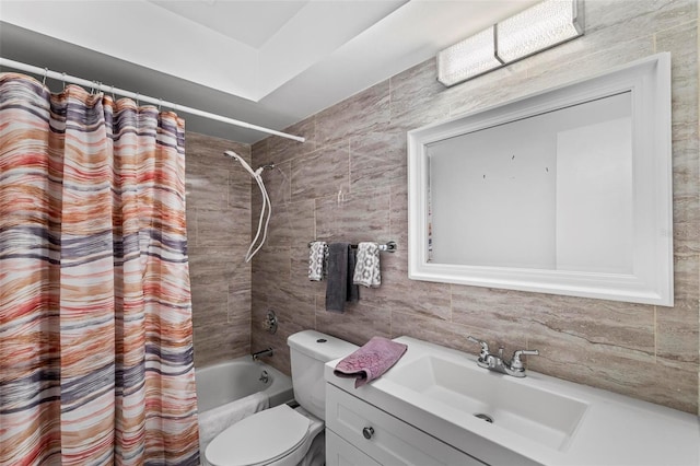 13 Belleaire Dr, Palm Coast, FL 32137 - full bathroom with decorative backsplash, tile walls, vanity, toilet, and shower / bath combo with shower curtain