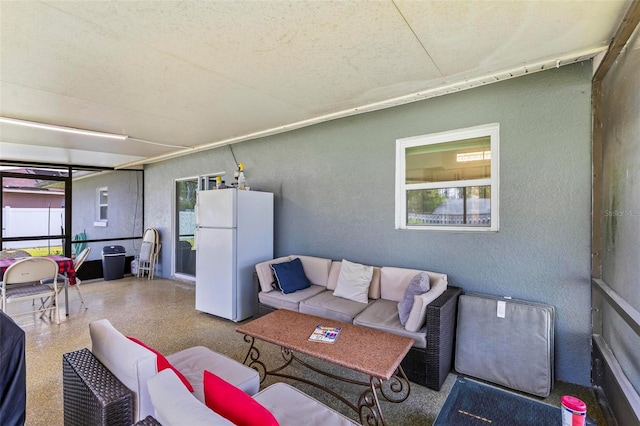 13 Belleaire Dr, Palm Coast, FL 32137 - living area featuring a textured wall