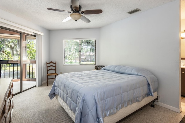 bedroom featuring multiple windows, light carpet, and visible vents