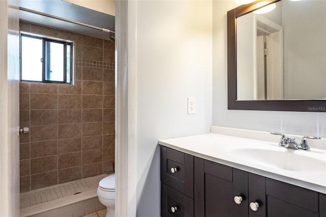 full bathroom featuring vanity, a shower stall, and toilet