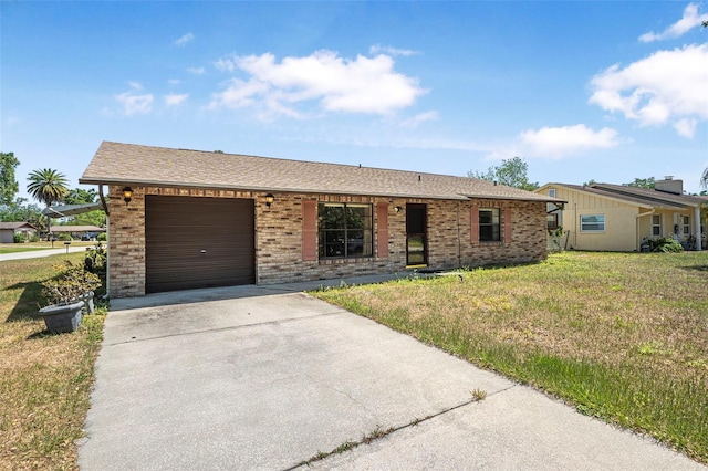 ranch-style house with an attached garage, driveway, a front lawn, and brick siding