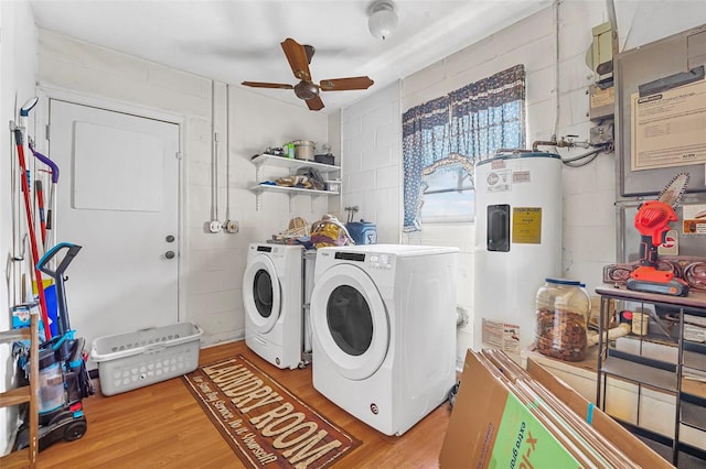 washroom featuring laundry area, a ceiling fan, wood finished floors, and electric water heater