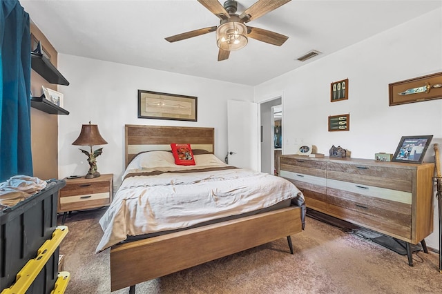 carpeted bedroom with ceiling fan and visible vents