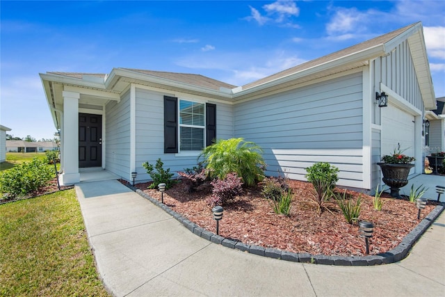 7 Windsor Ter, Palm Coast, FL 32164 - single story home with a garage and board and batten siding
