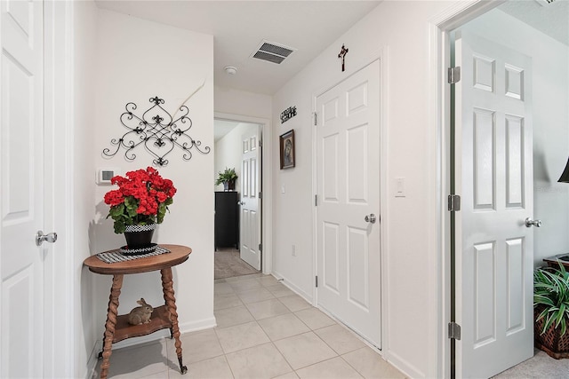 7 Windsor Ter, Palm Coast, FL 32164 - hall featuring light tile patterned floors, baseboards, and visible vents