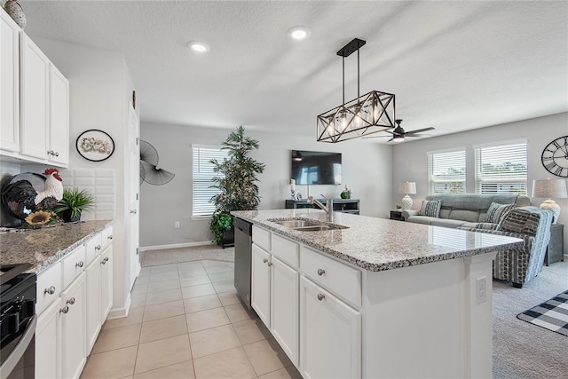 7 Windsor Ter, Palm Coast, FL 32164 - kitchen with white cabinets, appliances with stainless steel finishes, light carpet, and a sink