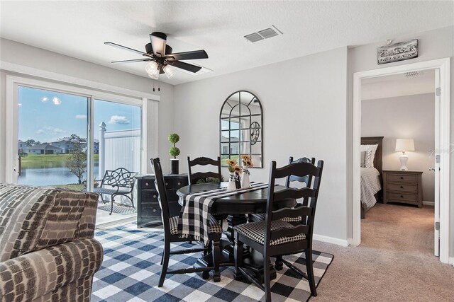 7 Windsor Ter, Palm Coast, FL 32164 - dining space with a ceiling fan, visible vents, plenty of natural light, and light carpet