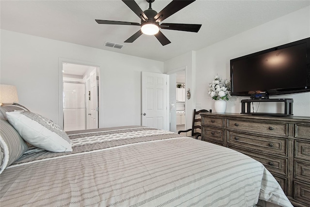 7 Windsor Ter, Palm Coast, FL 32164 - bedroom with visible vents, a ceiling fan, and ensuite bath