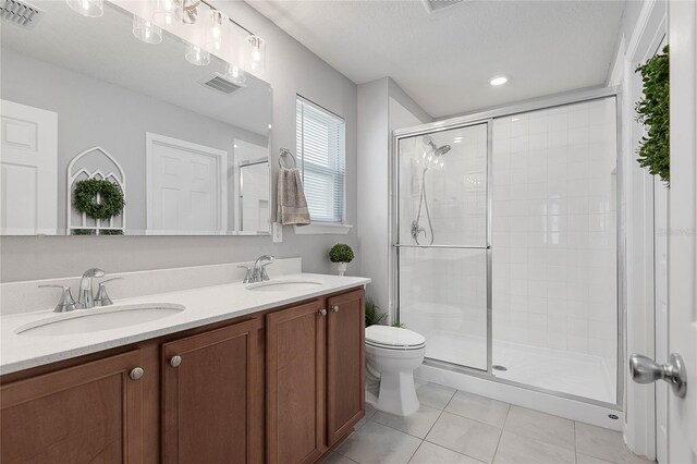 7 Windsor Ter, Palm Coast, FL 32164 - full bathroom featuring visible vents, a sink, tile patterned floors, and a stall shower