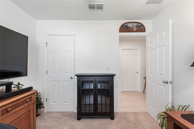 7 Windsor Ter, Palm Coast, FL 32164 - living room with light colored carpet, light tile patterned floors, and visible vents