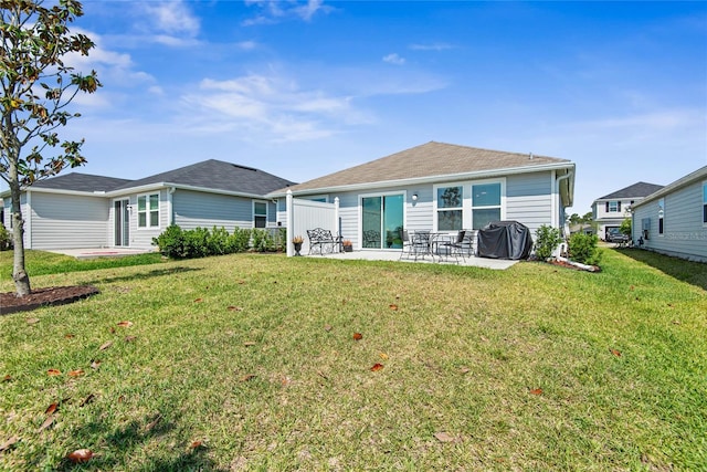 7 Windsor Ter, Palm Coast, FL 32164 - rear view of house with a lawn and a patio