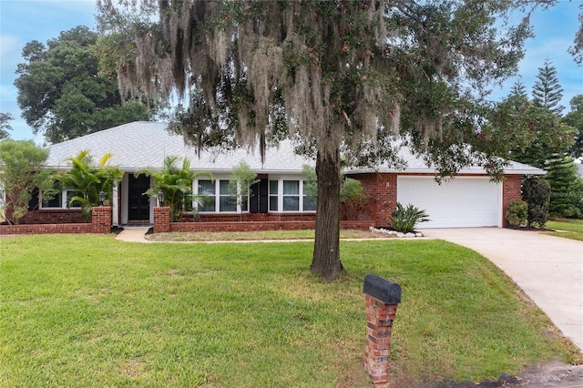 11 Larisa Ter, Ormond Beach, FL 32174 - ranch-style home featuring an attached garage, concrete driveway, brick siding, and a front yard