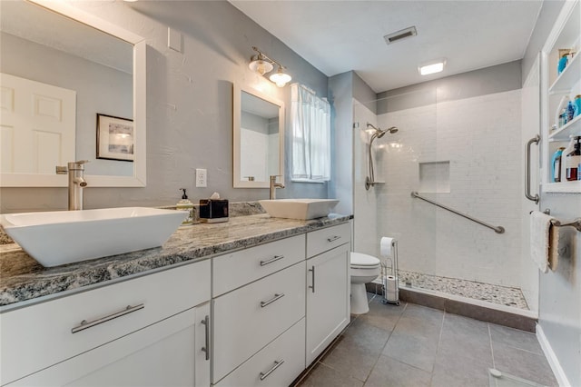 11 Larisa Ter, Ormond Beach, FL 32174 - bathroom featuring tile patterned floors, visible vents, a shower stall, and a sink