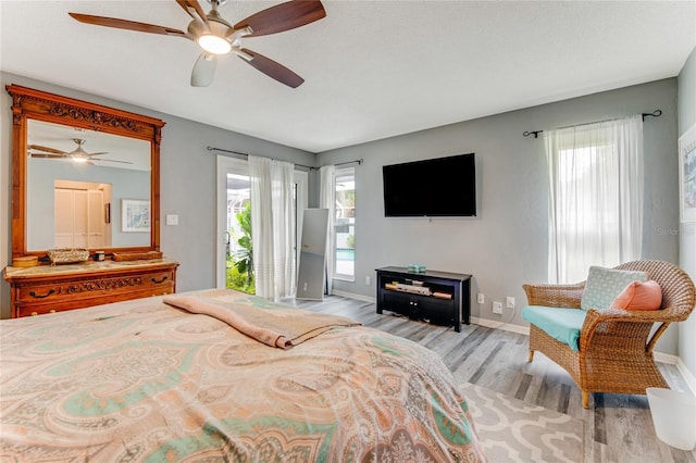 11 Larisa Ter, Ormond Beach, FL 32174 - bedroom featuring baseboards, access to outside, light wood-type flooring, and ceiling fan