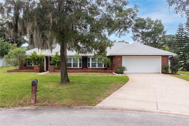 11 Larisa Ter, Ormond Beach, FL 32174 - single story home with an attached garage, brick siding, driveway, and a front yard