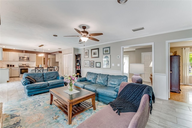 11 Larisa Ter, Ormond Beach, FL 32174 - living area with ceiling fan, visible vents, a wainscoted wall, ornamental molding, and recessed lighting