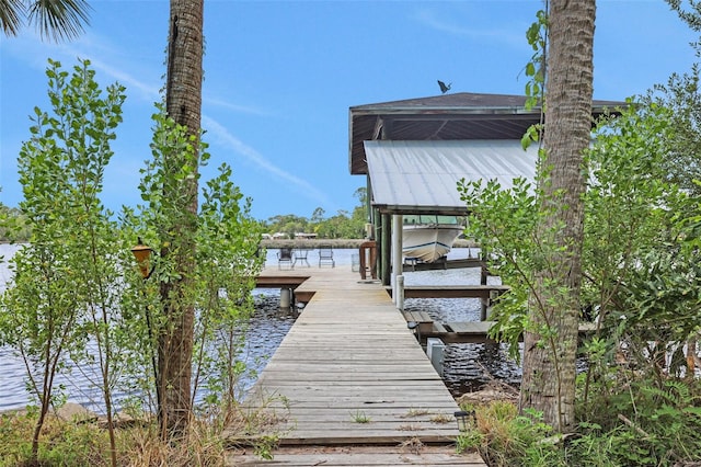 dock area featuring a water view
