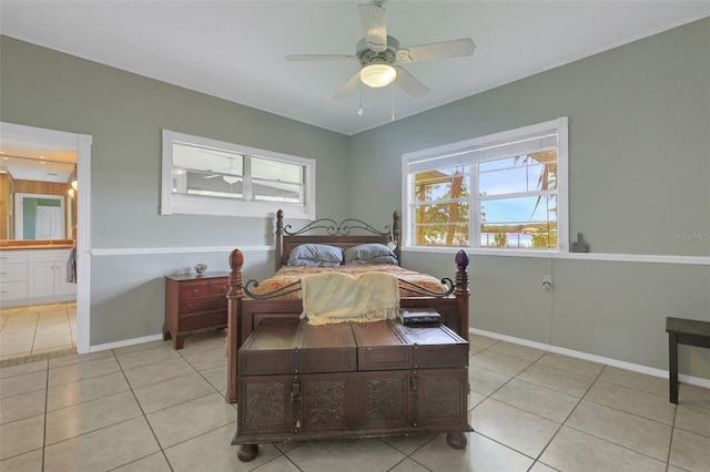 bedroom with baseboards, a ceiling fan, and light tile patterned flooring