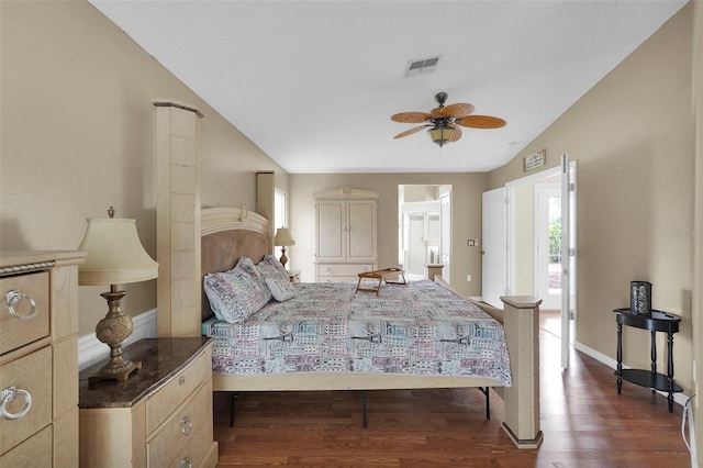 bedroom with visible vents, multiple windows, vaulted ceiling, and dark wood-type flooring