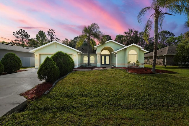 3 Bickford Dr, Palm Coast, FL 32137 - ranch-style house featuring a garage, a front yard, stucco siding, french doors, and concrete driveway