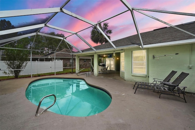 3 Bickford Dr, Palm Coast, FL 32137 - pool at dusk featuring a lanai, a patio, a fenced in pool, and fence
