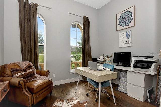 office area featuring baseboards and dark wood finished floors