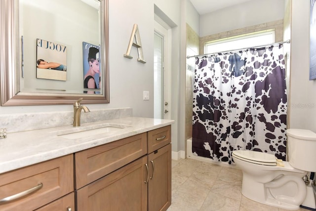 bathroom featuring toilet, tile patterned floors, shower / tub combo with curtain, and vanity