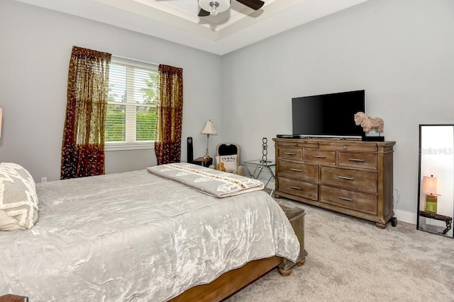 bedroom featuring a ceiling fan and light carpet