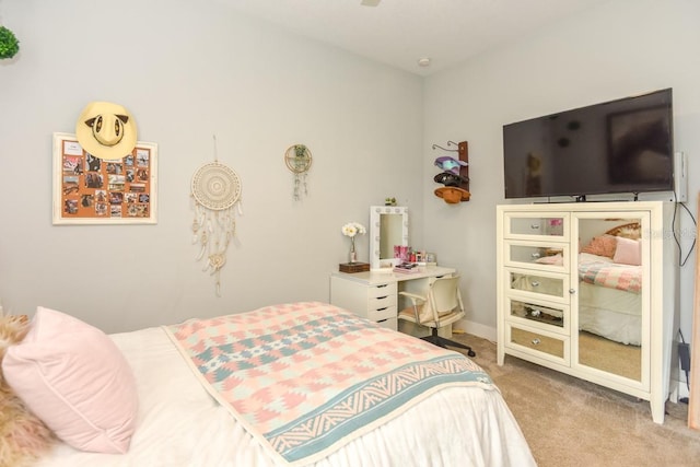 bedroom with baseboards and carpet flooring