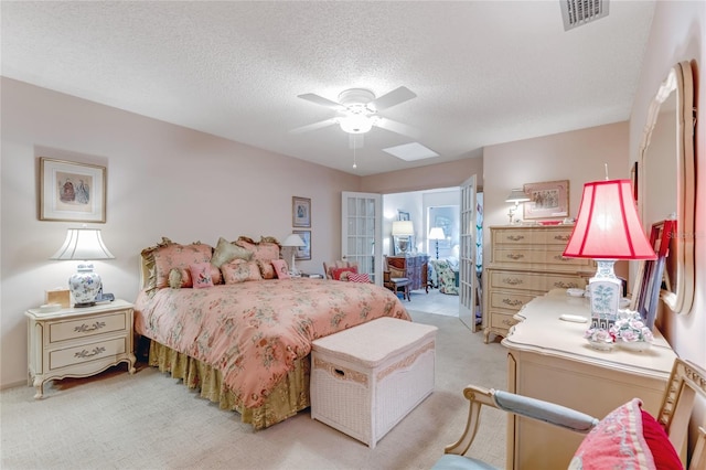 15 Morning Dew Trl, Ormond Beach, FL 32174 - bedroom with light carpet, a textured ceiling, a ceiling fan, and french doors