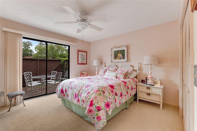 15 Morning Dew Trl, Ormond Beach, FL 32174 - bedroom with access to outside, carpet flooring, a textured ceiling, and ceiling fan