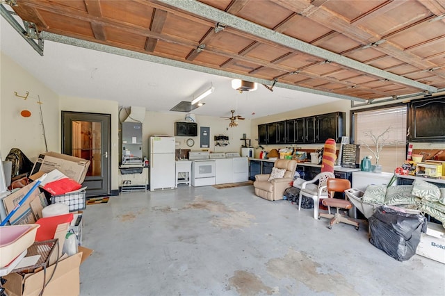 15 Morning Dew Trl, Ormond Beach, FL 32174 - garage with freestanding refrigerator, washer and clothes dryer, and electric panel