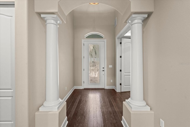 entrance foyer with ornate columns and hardwood / wood-style floors